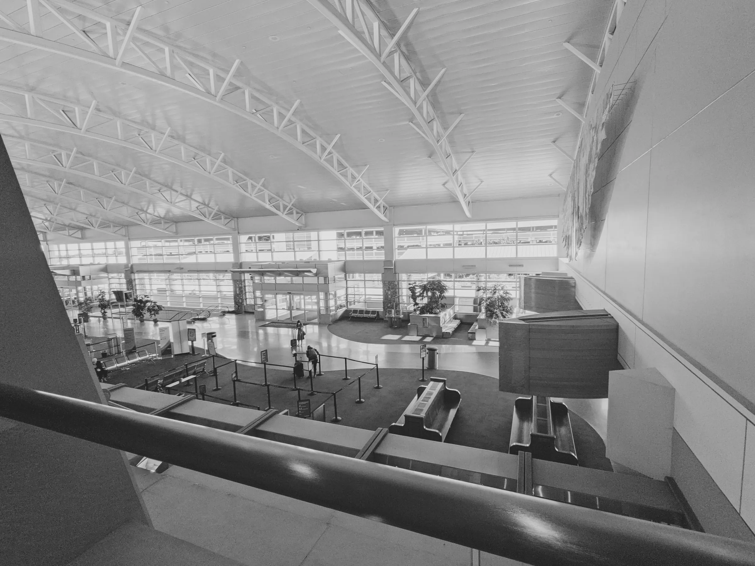 The ticket hall at Boise Airport, seen from the mezzanine above it.