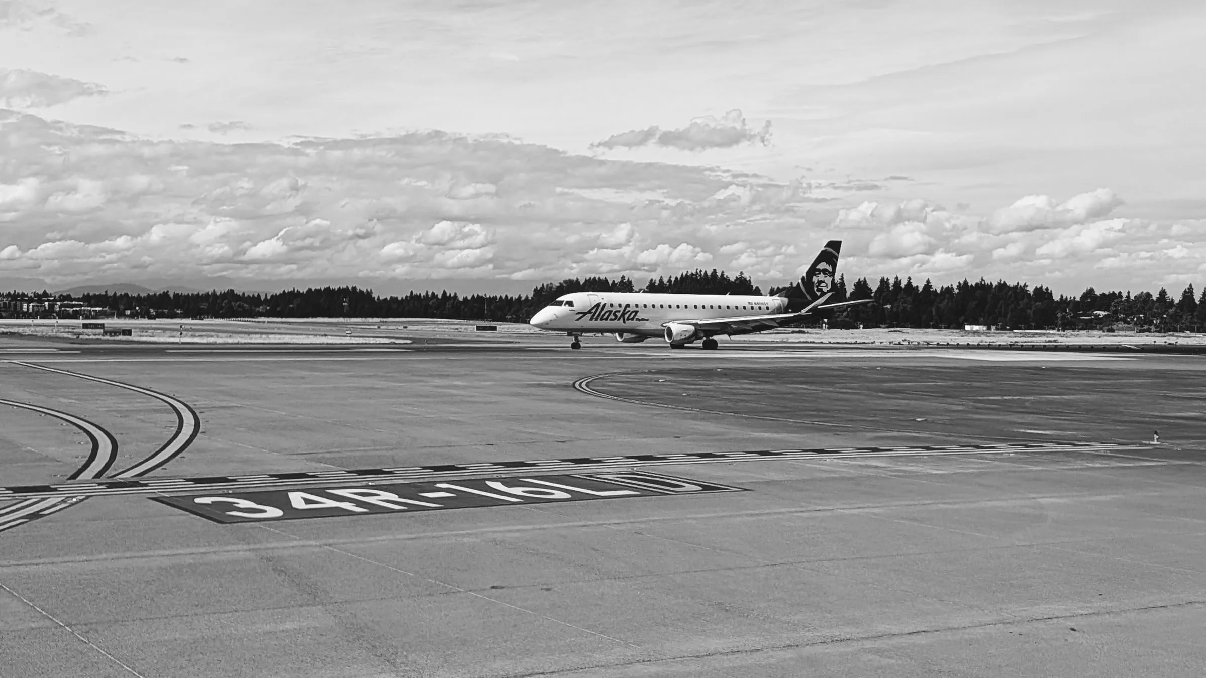 A regional jet lined up on the runway at Seattle-Tacoma.